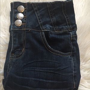 Dark denim blue jeans; high waisted